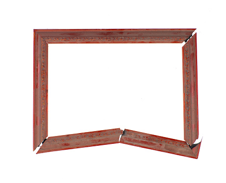 Overhead shot of back side wooden frame with stainless steel L-shape plate on white background.