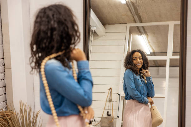 istock Cute young woman dressed in boho style posing near the mirror 1476267813