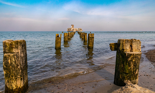 Old ruined wooden pier and abandoned fort on the Baltic sea in Gdynia