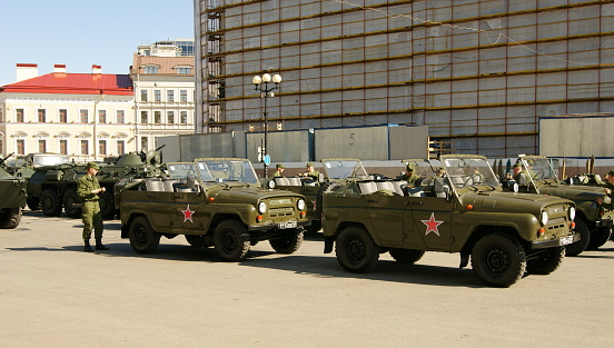 Russian military personnel and vehicles preparing for a parade in a Palace Square, St. Petersburg, Russia