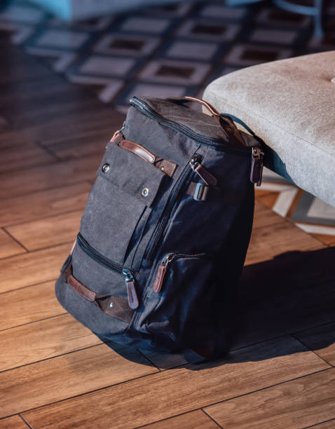 istock Canvas backpack for travelers. Canvas Backpack accessories in interior background. 1476270202