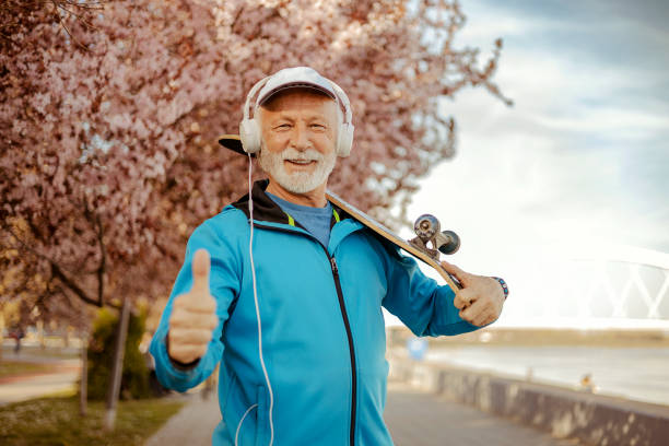 Senior Male Skateboarder With Thumbs Up