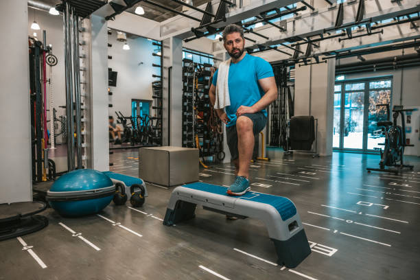 istock Man with towel in the gym after the workout 1476271055