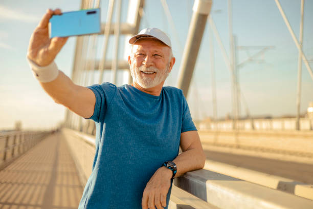 istock Senior Sportsman Taking Selfie 1476271068