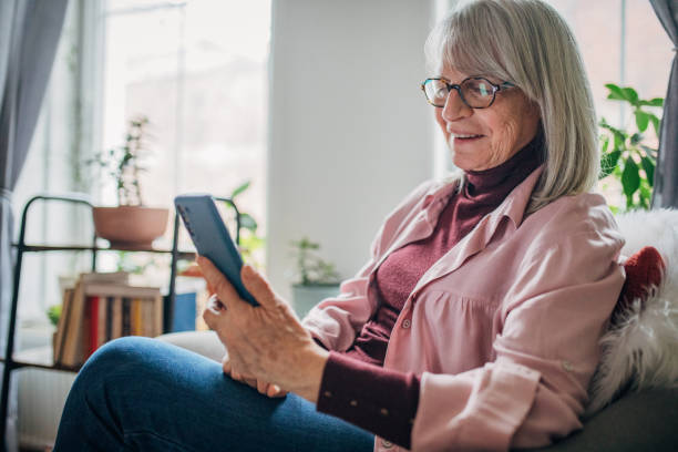 istock Modern senior woman using phone 1476272955