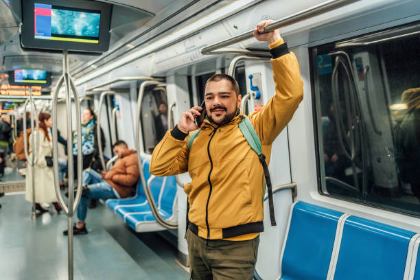 istock Man talking on the phone on a subway train 1476274202