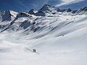beautiful ski tour in the swiss mountains. Super mountain weather for a long ski tour. High quality photo