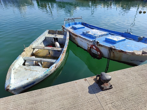 Old and small boats in El Serrallo, the maritime district in Tarragona