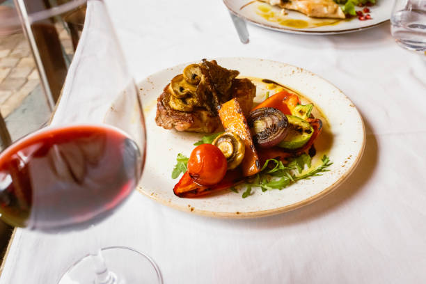 istock A Culinary Experience: A Red Wine and an Exquisite Meal in a Restaurant 1476284324