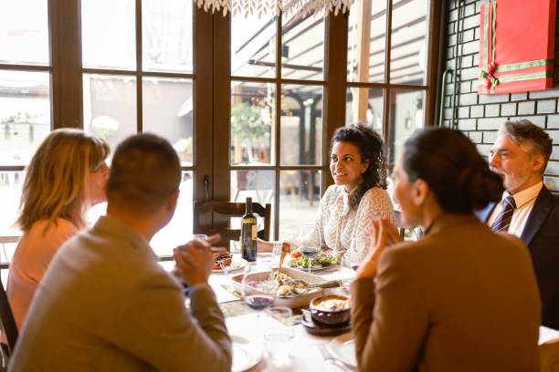 Colleagues Enjoying a Business Lunch stock photo