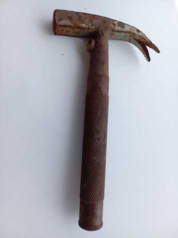 a hammer made of iron and rusted