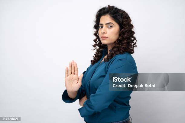 Prohibition Sign Portrait Of Young Businesswoman Serious Making Stop Sign With Her Hand On White Background Stock Photo Stock Photo - Download Image Now
