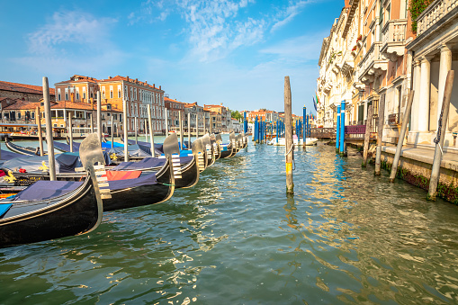 Venice, Italy - October 7th 2022: Motorboats in a useful way of transportation and are parked in most of the canals in the center of the old and famous Italian city Venice