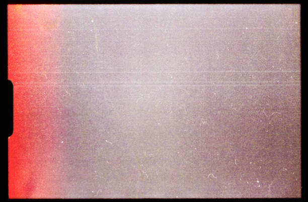 empty or blank super 8mm film frame with black border and dust. film texture. real super8 scan with empty frame or cell. analog stock pictures, royalty-free photos & images