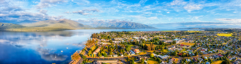 Lake Te Anau and Te Anau town in Fiordland of New Zealand - wide aerial panorama of Gateway to Milford Sound.