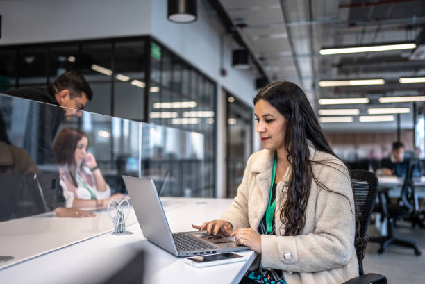 Young businesswoman working using laptop in the office