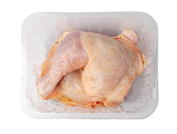 istock Raw Chicken Legs in a Plastic Container Isolated, Fresh Chicken Quarter on White Background 1476307364