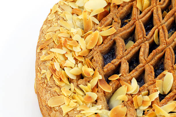 Linzer torte pie with almonds detail on white stock photo