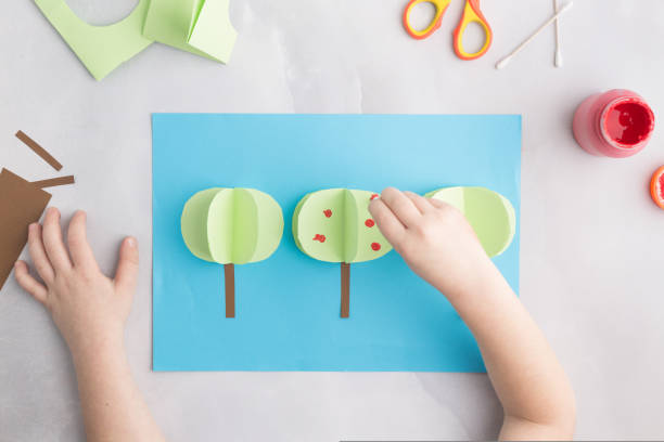 istock simple kids paper craft painting apple tree with cotton buds 1476307540