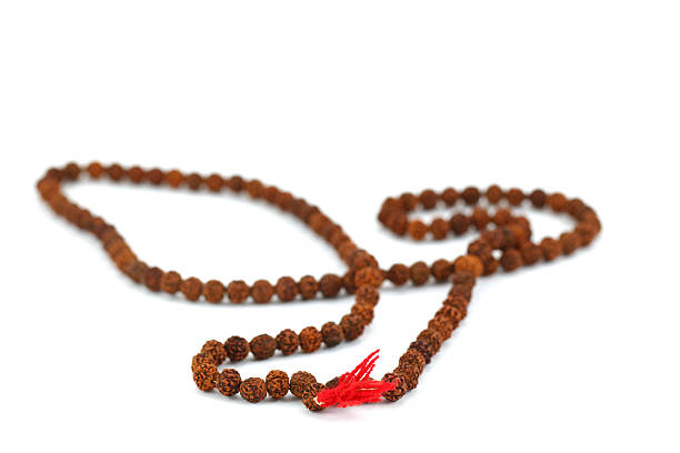 Hindu and buddhist prayer beads garland on white Hindu and buddhist prayer beads garland on white background sumeru stock pictures, royalty-free photos & images