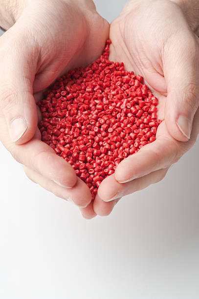 Granules  pellet in hand Granules pellet in hand pellet gun stock pictures, royalty-free photos & images