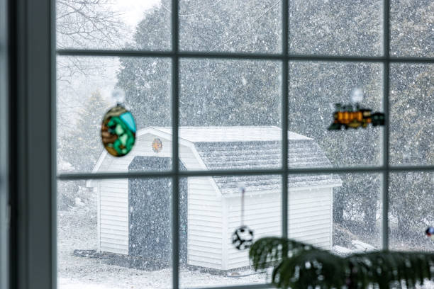 istock Blizzard Snow Garden Shed Viewed Through Winter Back Yard Bay Window 1476338394