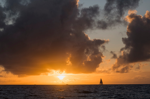 Sunset in Oahu, Hawaii. Retirement and travel themes. Sailing concepts.