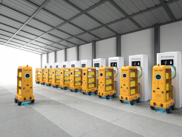 istock Warehouse robots charge with electric charging stations 1476342593