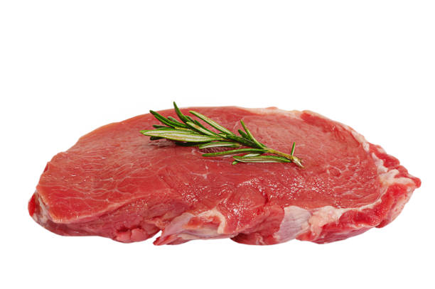 istock Raw fresh beef steak isolated on white background. Meat with rosemary. 1476355653