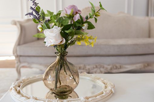Antique style room, with a vase flower arrangement with copy space