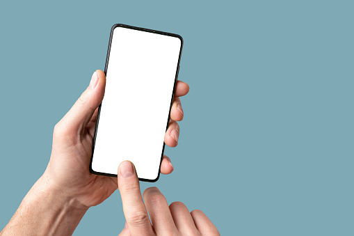 Mobile phone mock-up, finger touching, pointing on smartphone screen, display mockup in hand on blue background.