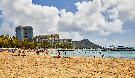 Waikiki, Oahu, Hawaii, USA, - February 13, 2023: The Beach in Waikiki with Diamond Head Crater in the Background
