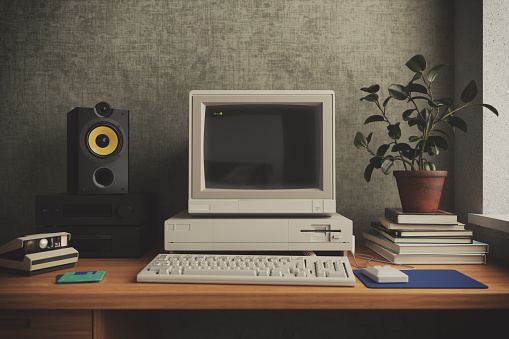 A retro study room features a computer on a wooden desk, surrounded by retro decor and nostalgic elements.