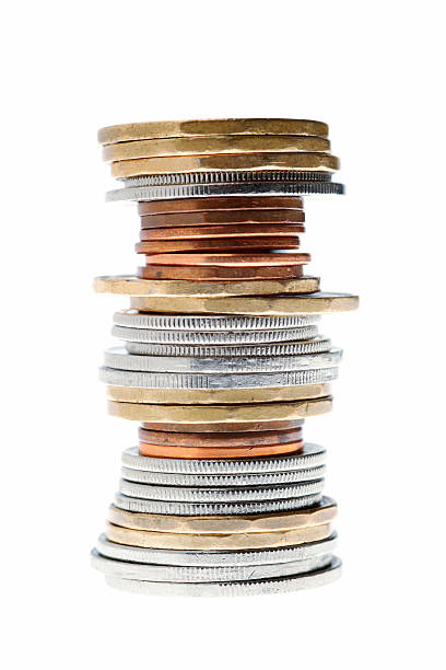 an imbalanced stack of Canadian coins Imbalanced stack of Canadian Coins loonies and toonie stock pictures, royalty-free photos & images