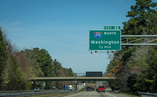 An interstate highway sign directs drivers into Washington, DC, USA.