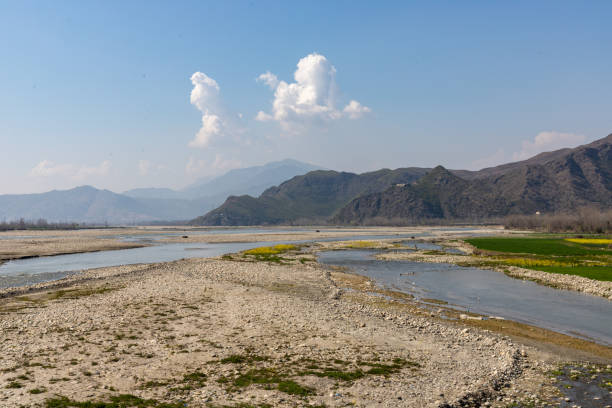istock Rural landscape with a river and fields under a blue sky panoramic view from a hill 1476401969