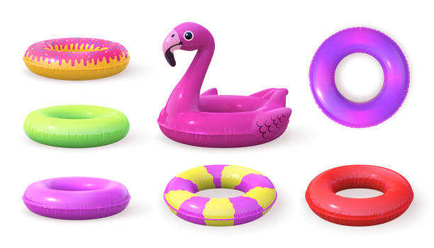 istock 3d inflatable swimming rings designs, doughnut and pink flamingo. Realistic pool rubber circle top and side view. Swim lifesaver vector set 1476404367