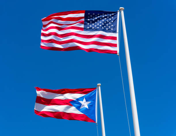 istock Puerto Rican and American Flags against a blue sky 1476405211