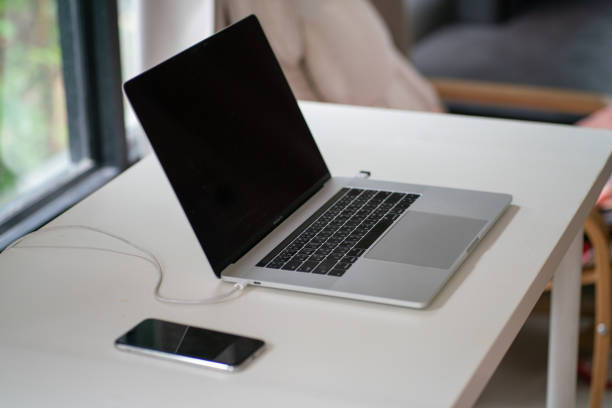 Laptop on white table black sceen in cozy house work from home concept