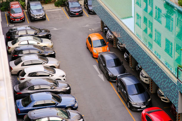 istock Car parking lot in modern condominium living look down view 1476422436