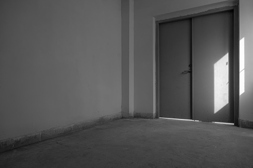 Old abandoned doors of elevator in ruined building