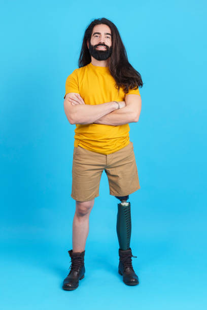 istock Man with a leg prosthesis standing with arms crossed 1476425293