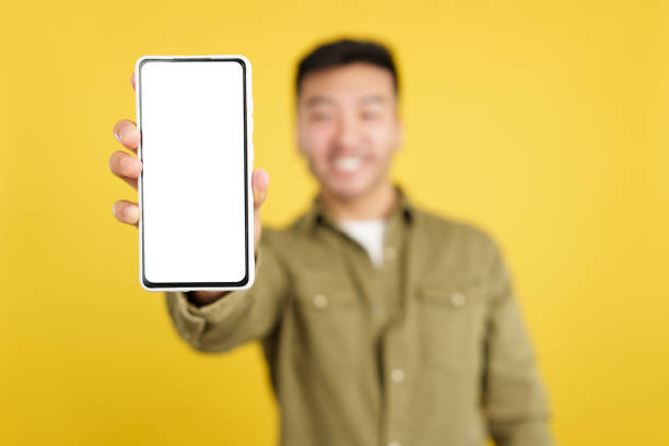 istock Blank screen of the mobile held by a chinese man 1476425486