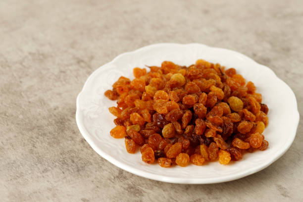 Organic Dried Golden Raisins in White Plate