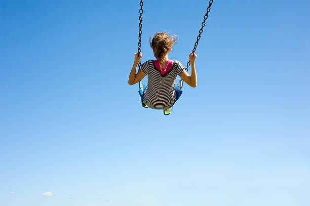istock Young Girl on Swing 147643463
