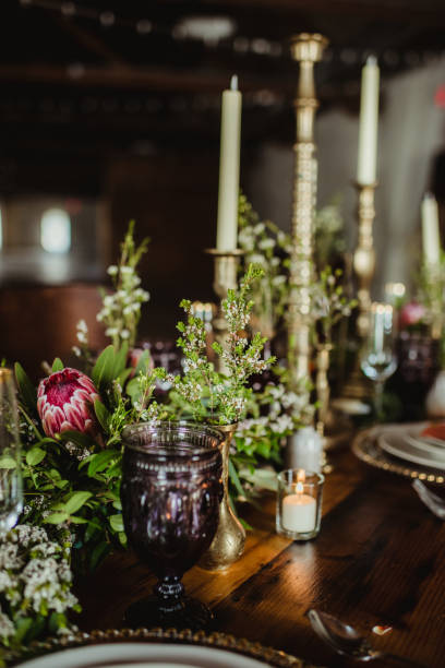 istock Candles and flowers on a dinner table 1476435300