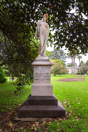Auckland, New Zealand - March, 2023: Marble statue of a woman with a dove in her hand. Unknown artist, 1900. Auckland City, Albert Park. THIS — STATUE was purchased in terms of the will of HELEN BOYD and presented to the Citizens of Auckland on behalf of George and Helen Boyd deceased..