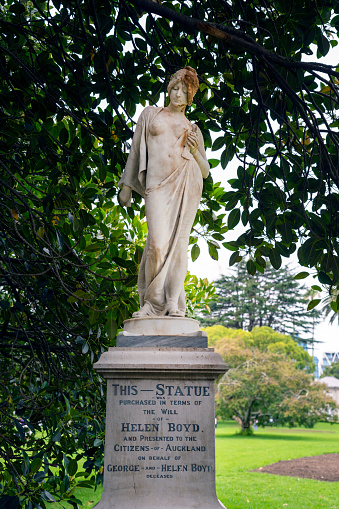 Auckland, New Zealand - March, 2023: Marble statue of a woman with a dove in her hand. Unknown artist, 1900. Auckland City, Albert Park. THIS - STATUE was purchased in terms of the will of HELEN BOYD and presented to the Citizens of Auckland on behalf of George and Helen Boyd deceased..
