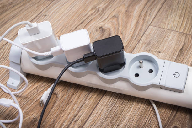 istock Smartphone chargers connected to electrical power strip. Various devices charging 1476455245