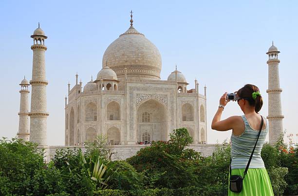 Tourist in front of Taj Mahal stock photo